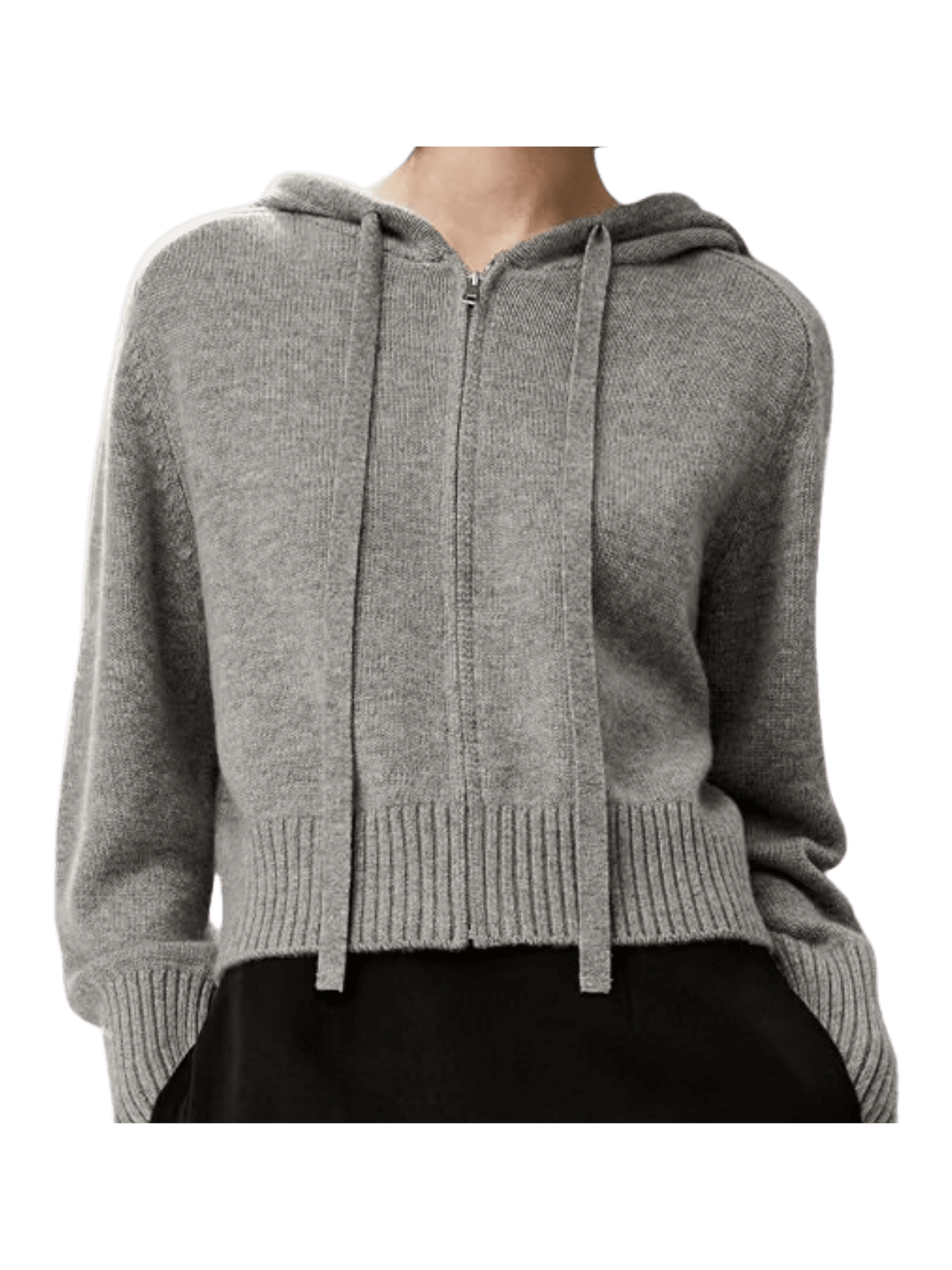 A woman wears a heather grey zip-up cashmere hoodie with a drawstring hood and ribbed hem